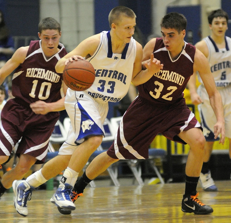 Michael Christie, left, and Wade Tuttle of Richmond chase Central Aroostook's Brendan York during the Class D boys' basketball state championship game Saturday at the Bangor Auditorium.