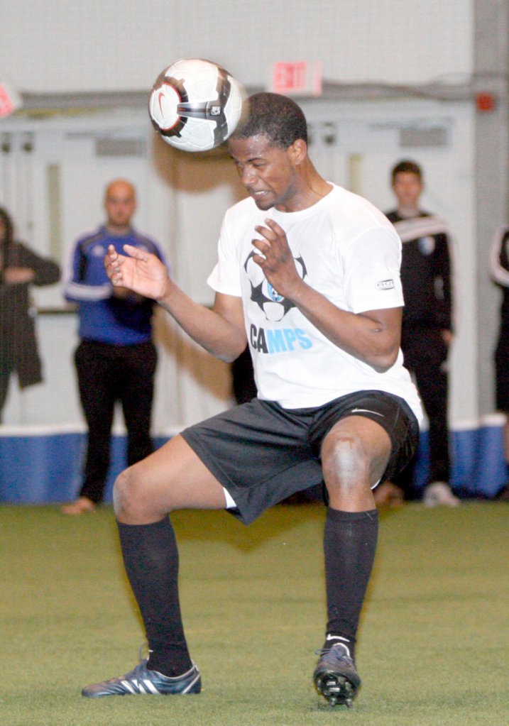 Forward Dale McDonald heads the ball during a recent first-team practice with the Portland Phoenix. The team opens its season tonight.