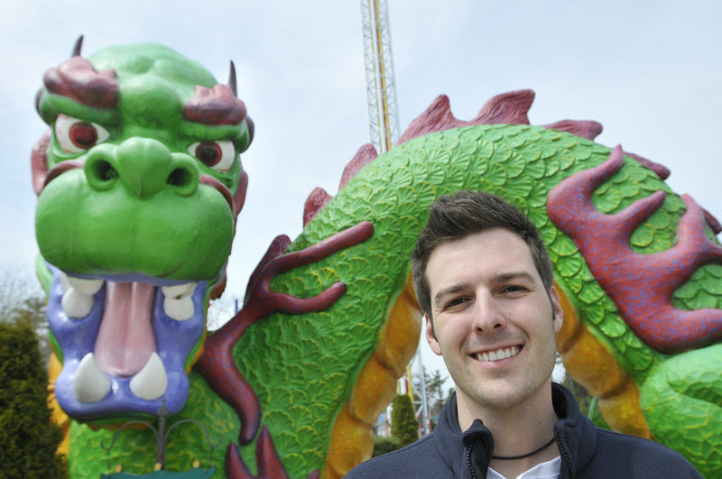 Ben Santos-Rogers, operations manager, started working at Funtown/Splashtown USA as a game attendant 13 years ago. He’s standing in front of Dragon’s Descent, northern New England’s largest vertical thrill ride at 220 feet tall.