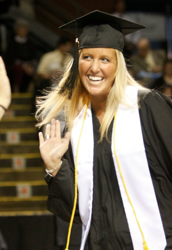 Jaclyn Proulx of Concord, N.H., high-fives a friend after receiving her diploma in English and education. The University of New England awarded 1,247 degrees on Saturday.