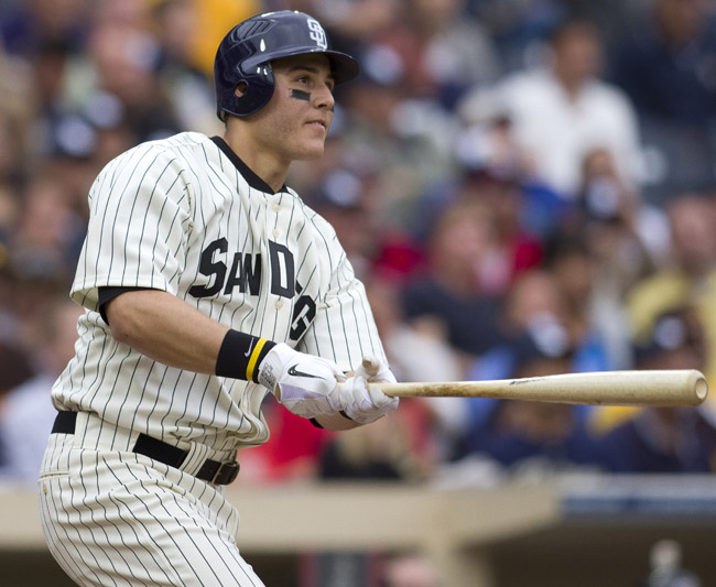 In this June 11, 2011, photo, San Diego Padres' Anthony Rizzo follows through on a one-run home run during a game against the Washington Nationals.