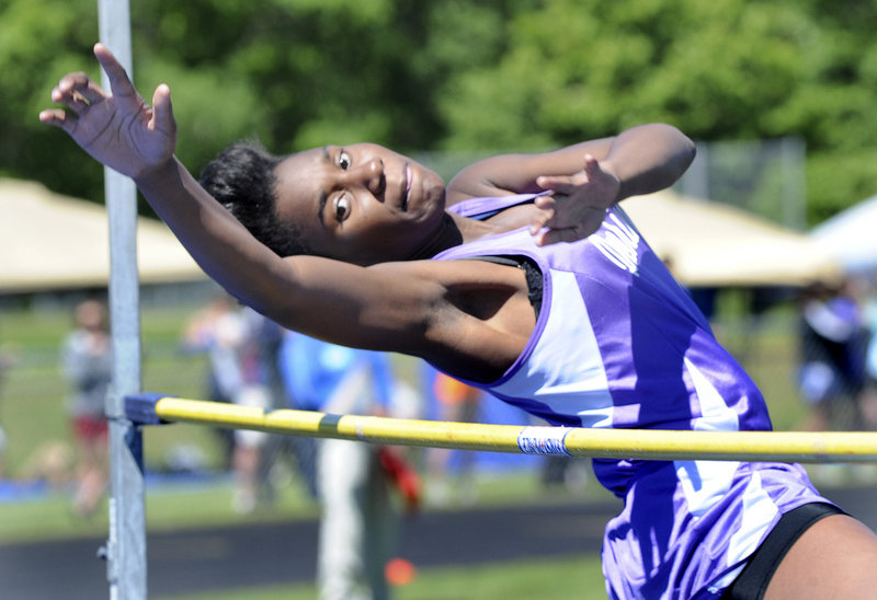 Deering’s Rashad Zagon clears the high jump bar at 4 feet, 10 inches. Cheverus’ Caroline Summa won with a jump of 5-2.