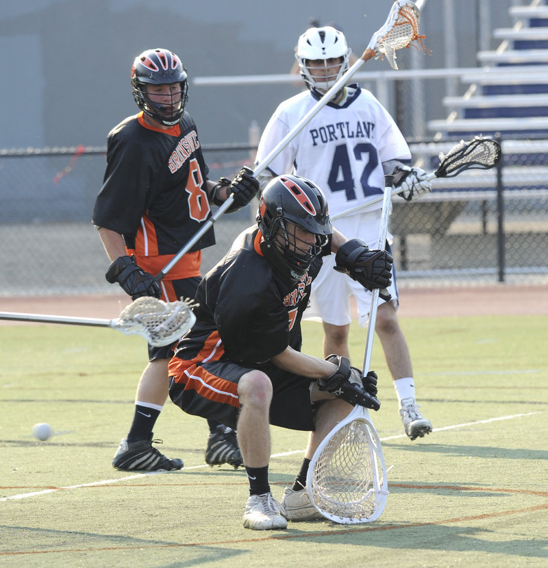 The ball gets past Brunswick goalkeeper James Wilgus as Caleb Kenney scores Portland’s fourth goal Wednesday. Portland had a huge fourth quarter to beat Brunswick 15-6 in their regional quarterfinal.