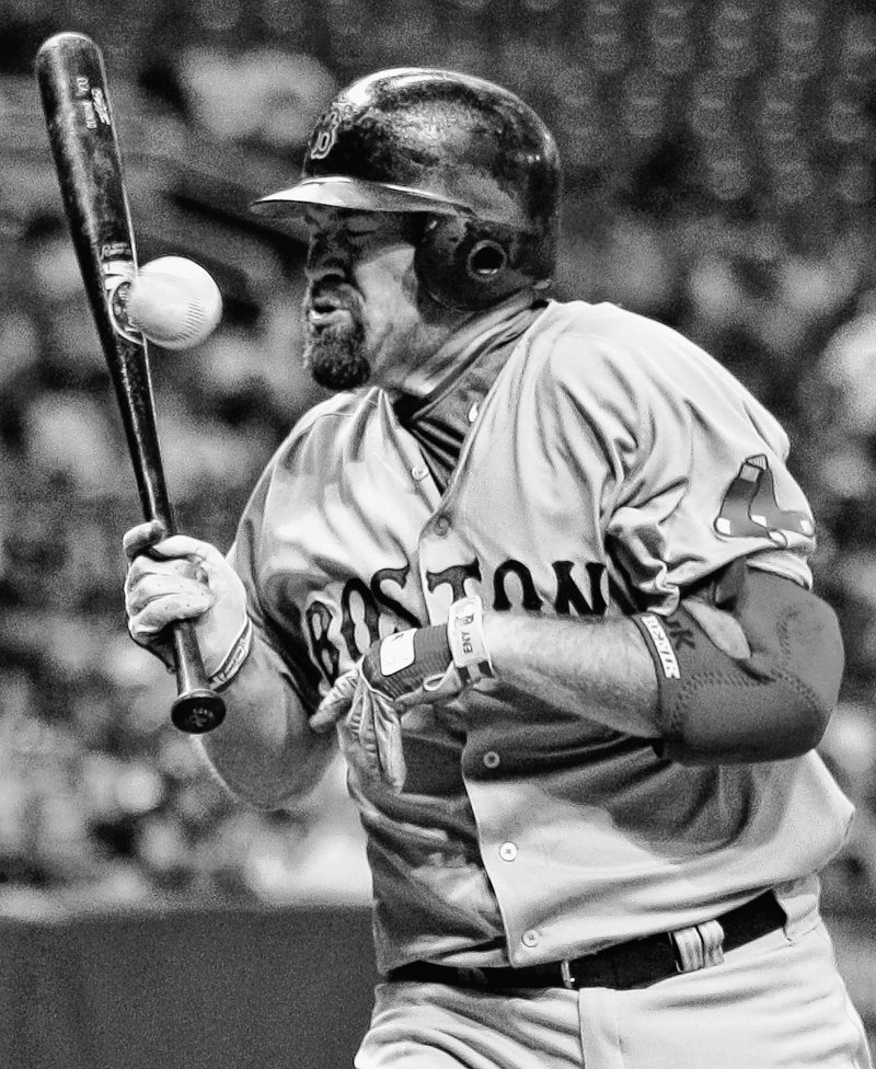 Boston’s Kevin Youkilis gets hit with a pitch from Tampa Bay’s David Price in the first inning Thursday in St. Petersburg, Fla. The Red Sox won 4-2 to maintain a 1 1⁄2-game lead on the Yankees in the AL East.