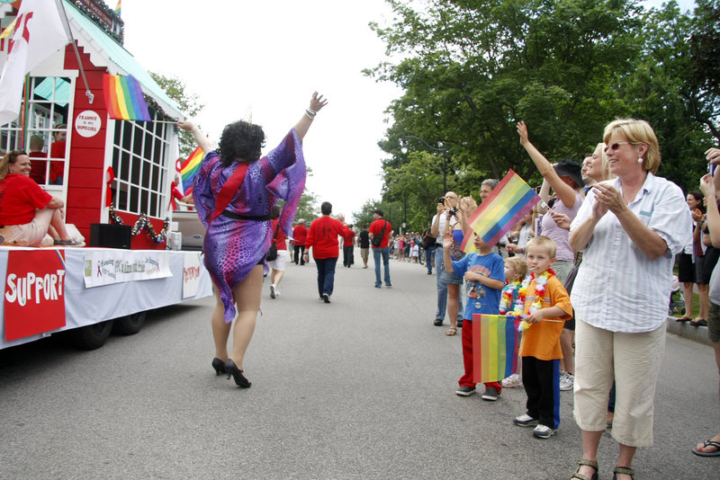 Onlookers of all ages cheer as the parade makes its way to Deering Oaks for the Saturday afternoon festival.