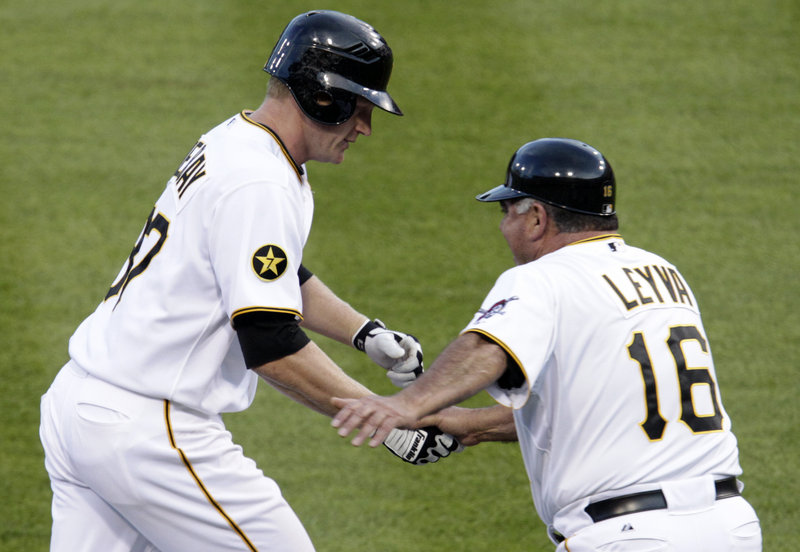 Lyle Overbay is congratulated by Pirates third-base coach Nick Leyva after his three-run homer Saturday helped the Pirates beat Boston 6-4 at Pittsburgh.