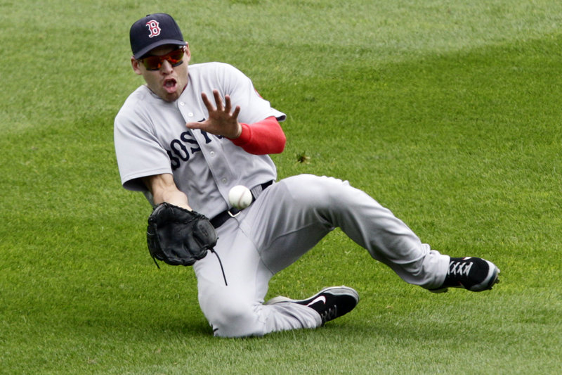 Center fielder Jacoby Ellsbury slides to make a catch on a sacrifice fly by Pittsburgh’s Ronnie Cedeno during the fourth inning Sunday in Pittsburgh. Neil Walker scored from third on the play. Boston went on to win, 4-2.