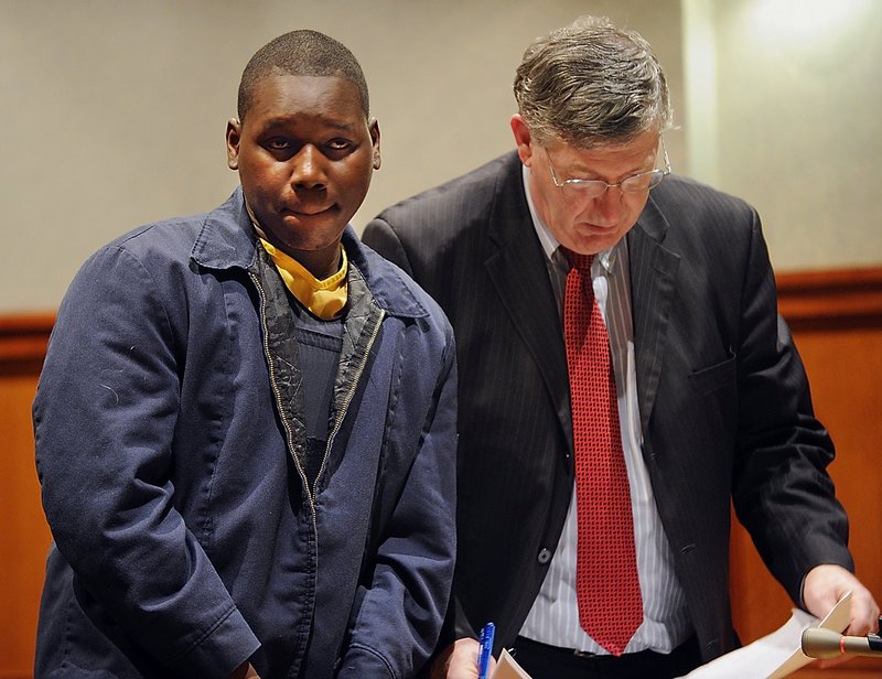 Moses Okot appears at his February 2010 arraignment in Cumberland County Superior Court in Portland.