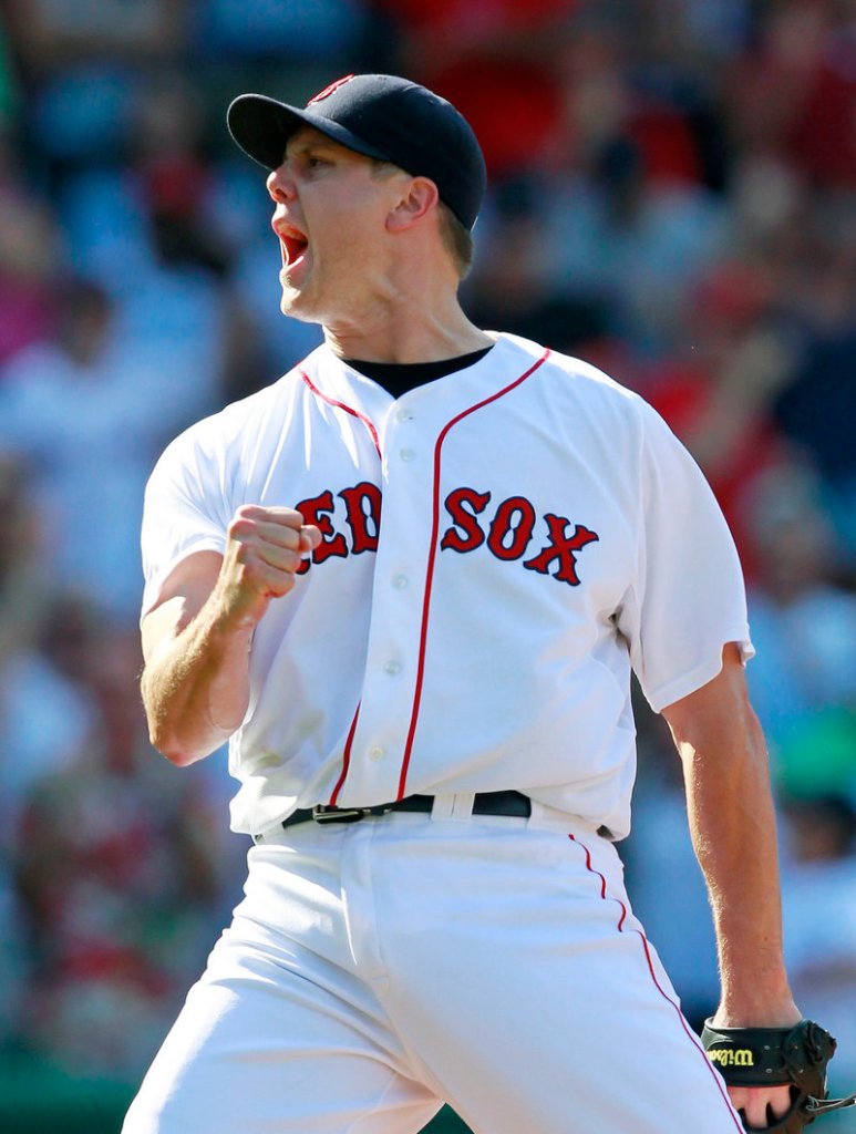 Jonathan Papelbon reacts after striking out Baltimore’s Nick Markakis to end Boston’s 8-6 win over the Orioles on Sunday.