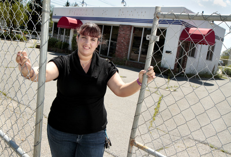 Carla Mains, 23, a granddaughter of restaurateur Jack Angelone, says she won’t be around when the bulldozers raze this former store on Broadway and Ocean Street.