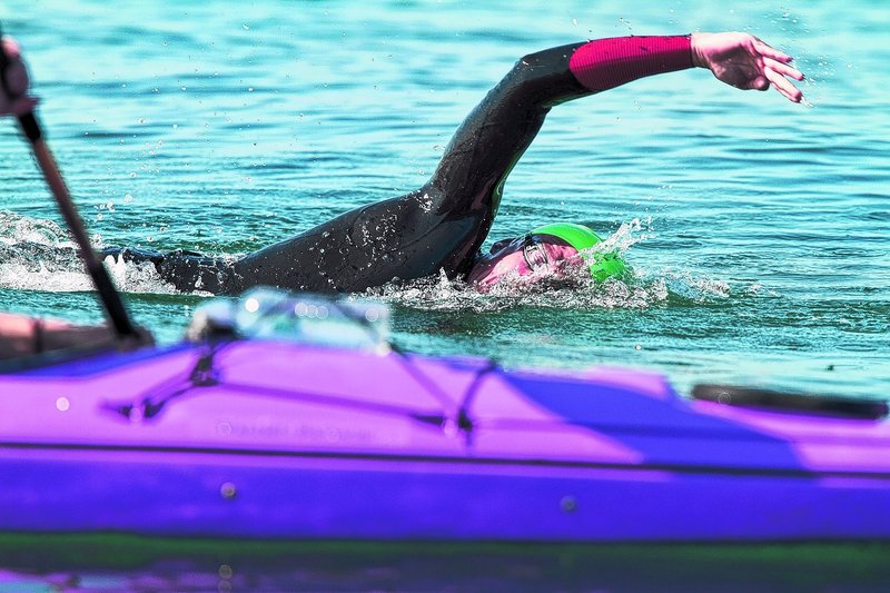 Scott Yeomans of Bethlehem, Pa., keeps his focus on his kayaker while heading toward the finish at East End Beach to win the 30th Peaks to Portland Swim.