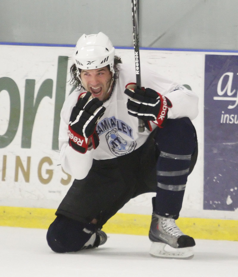 Dennis McCauley, a former Portland Pirate, hams it up after scoring a goal with less than a second left in the game on Sunday afternoon.