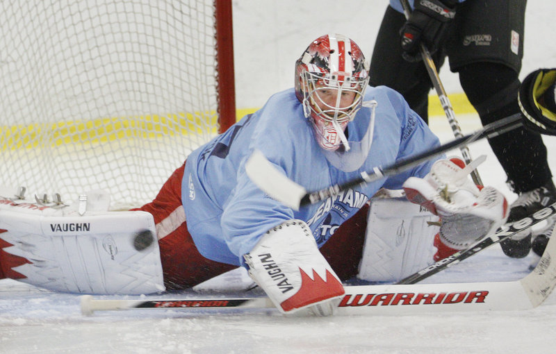 Jimmy Howard scrambles for the puck recently during a charity game held to raise money for brain injury and seizure research. It was Howard's first time on skates since his NHL season ended.