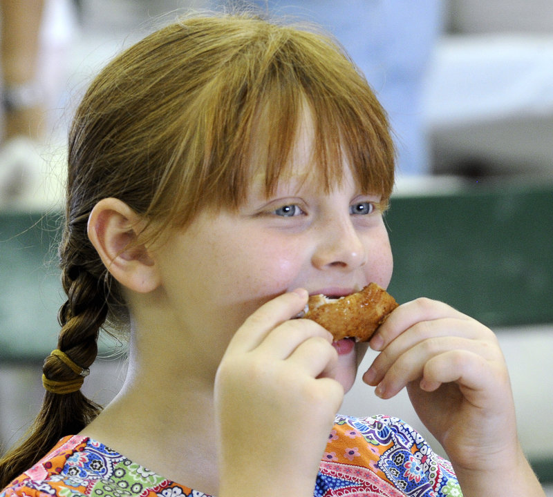 Leah Wimpfheimer, 8, samples a saucy delicacy entered in the People’s Choice competition.