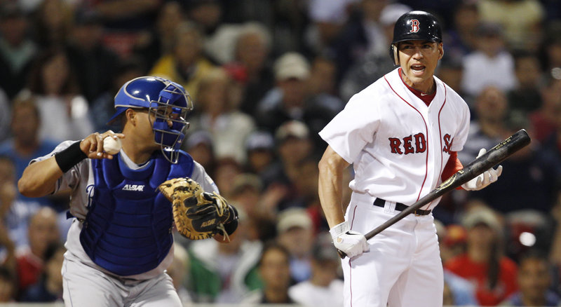 Jacoby Ellsbury, right, reacts after striking out against the Royals on Monday night at Fenway. The teams endured a 2-hour, 21-minute rain delay. The score was tied at 1 after 10 innings.