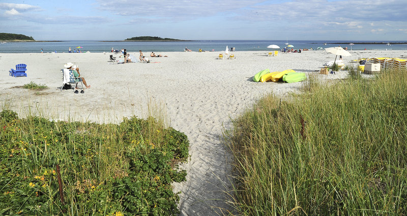 A small public path leads to a small section of public beach at Goose Rocks Beach in Kennebunkport.