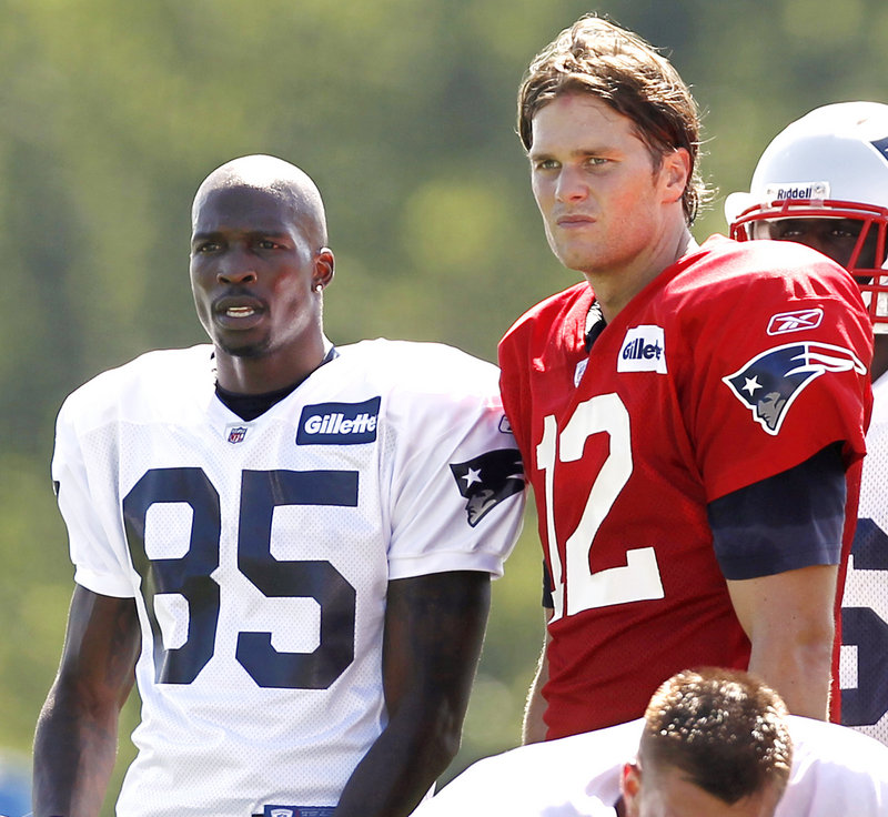 Chad Ochocinco, left, will be part of a talented group of receivers for quarterback Tom Brady, right, as the New England Patriots prepare for the National Football League season with their training camp at Foxborough, Mass.
