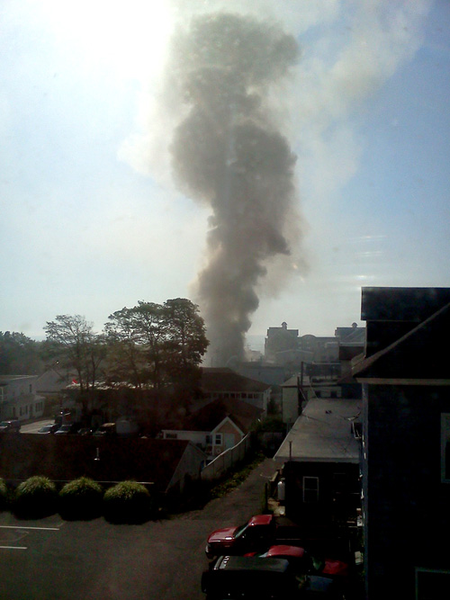 Thick smoke rises from the fire scene at the Galaxy. Contributed photo by Dennis Robbilard of Old Orchard Beach.