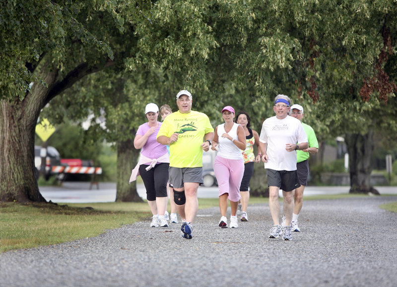 Roger Morse, front left, leads a group around Baxter Boulevard in Portland as they prepare for the Beach to Beacon, scheduled for Saturday in Cape Elizabeth.