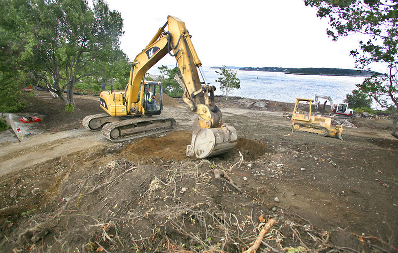 Ryan Chapman of L.P. Murray and Sons does work Monday in preparation for walkways at one site of the future arboretum along the cliff at Cape Elizabeth’s Fort Williams Park. Invasive plants have been removed and native species will be planted.