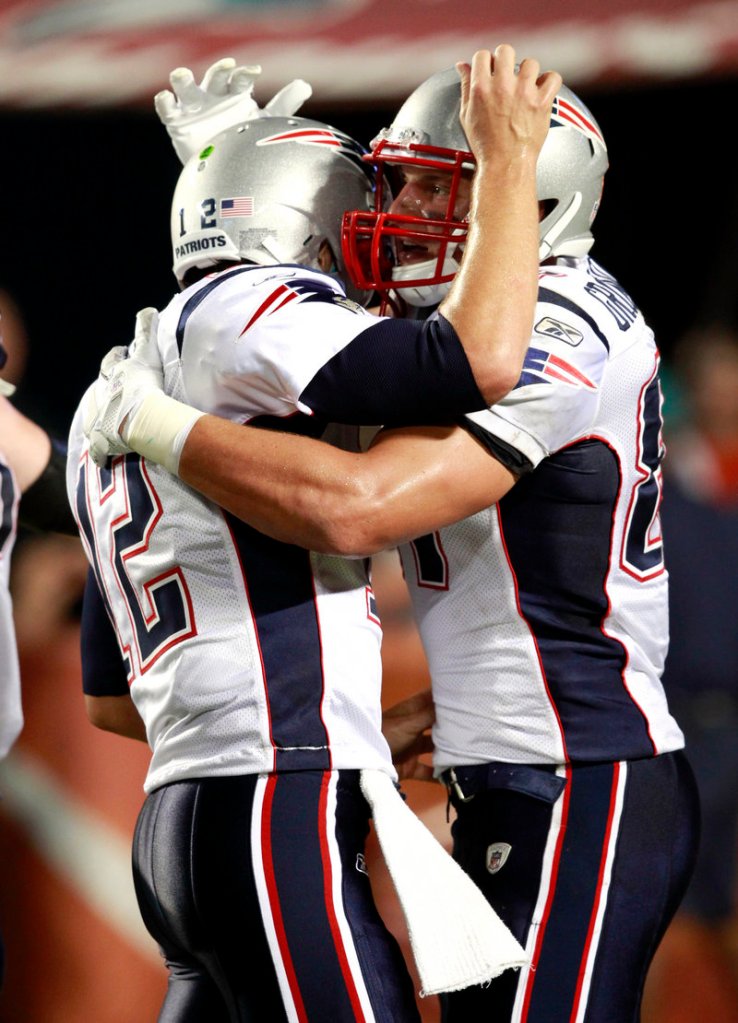 Quarterback Tom Brady, left, and tight end Rob Gronkowski helped produce the best offensive game in club history Monday night, but Pats Coach Bill Belichick saw weak spots.