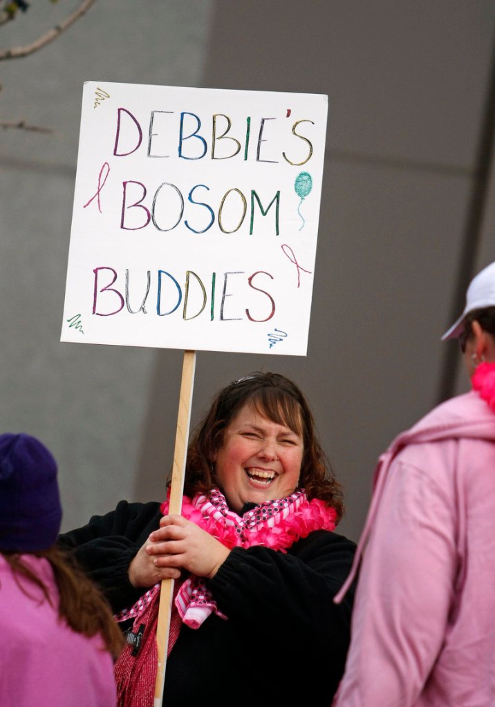 Debbie Winship of Gray, who was diagnosed this summer with Stage 4 breast cancer, has a laugh with a friend on her team during the Making Strides Against Breast Cancer walk.