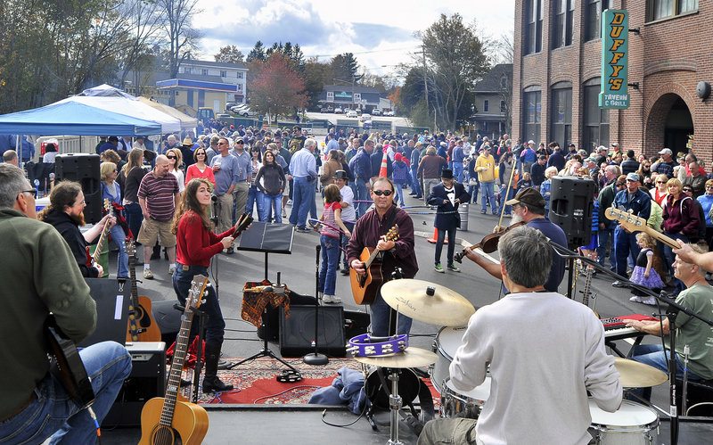 The Kennebunk River Band entertains a crowd at a barbecue hosted by Duffy’s Tavern & Grill on the approach to the Mousam River Bridge in Kennebunk on Saturday.