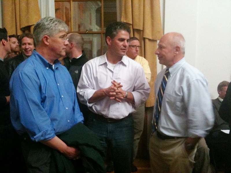 Michael Brennan, right, seen talking with fellow mayoral candidates Nicholas Mavodones, left, and Ethan Strimling, at Portland City Hall tonight, has been elected mayor of Portland.