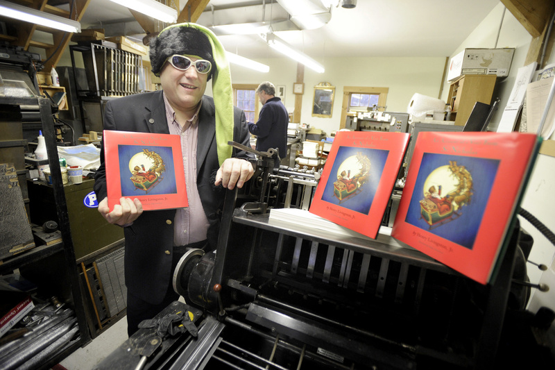 Publisher Michael Billmeyer shows the new book, “An Account of a Visit from St. Nicholas” at Ascensius Press in Freeport, where it was printed. Only 250 copies have been produced, making it a collector’s edition.