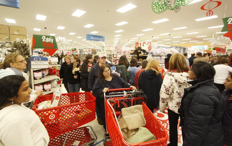 Black Friday shoppers navigate the crowded aisles at Target in South Portland shortly after the doors opened last year.