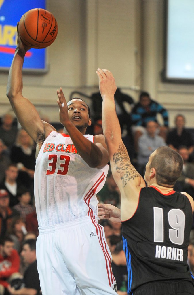 Chris Wright of the Maine Red Claws scores on a jump hook over Dennis Horner of the Springfield Armor on Saturday night.