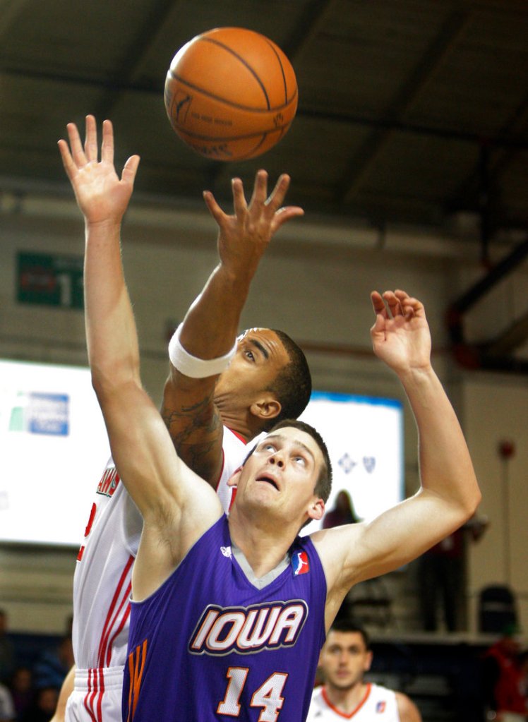 Thomas Baudinet of the Iowa Energy competes with Jamar Abrams of the Red Claws for a rebound Friday night during Iowa’s 111-102 comeback win at the Expo. The teams meet again today.