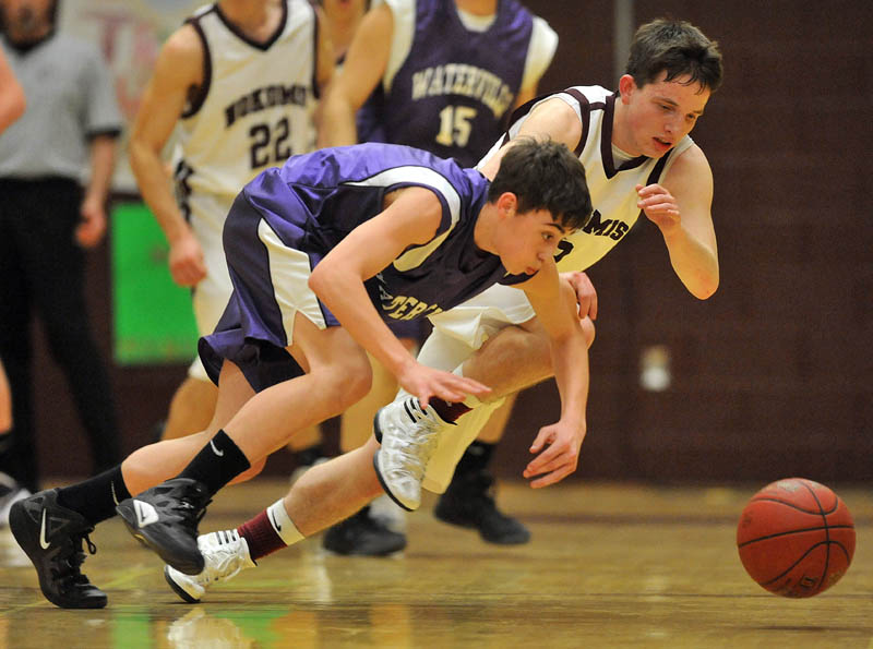 Photo by Michael G. Seamans Game action from Eastern Class B boys playoff game at Nokomis High School in Newport Wednesday night. Nokomis defeated Waterville 50-49 in overtime..