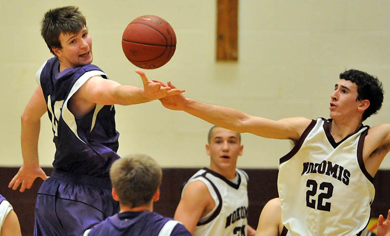 Photo by Michael G. Seamans Game action from Eastern Class B boys playoff game at Nokomis High School in Newport Wednesday night. Nokomis defeated Waterville 50-49 in overtime..