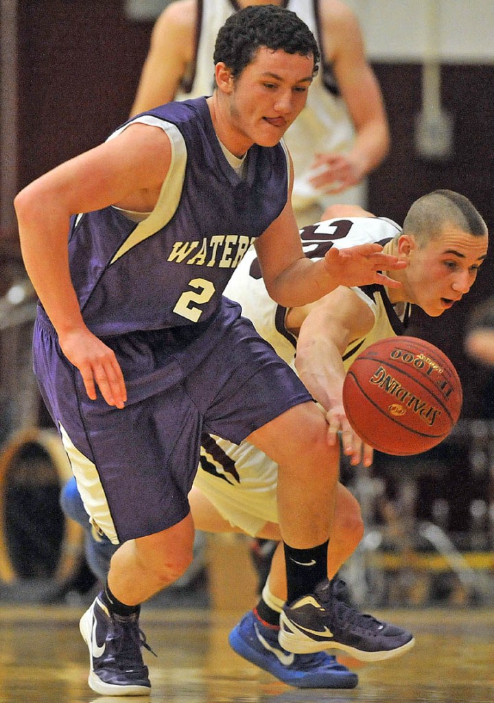 Photo by Michael G. Seamans Game action from Eastern Class B boys playoff game at Nokomis High School in Newport Wednesday night. Nokomis defeated Waterville 50-49 in overtime..