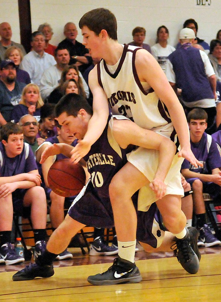 Photo by Michael G. Seamans Game action from Eastern Class B boys playoff game at Nokomis High School in Newport Wednesday night. Nokomis defeated Waterville 50-49 in overtime..