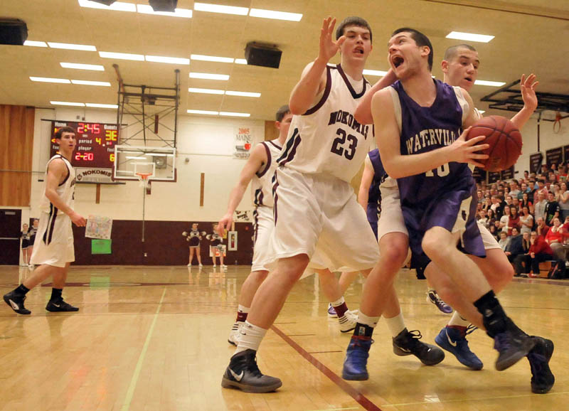 Photo by Michael G. Seamans Game action from Eastern Class B boys playoff game at Nokomis High School in Newport Wednesday night. Nokomis defeated Waterville 50-49 in overtime..