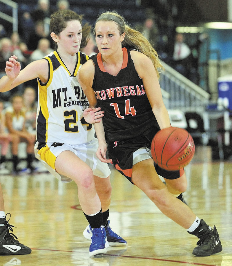 Mt. Blue’s Amy Hilton, left, covers Skowhegan’s Amanda Johnson during the Indians’ 56-55 overtime win. Johnson scored 27 points.