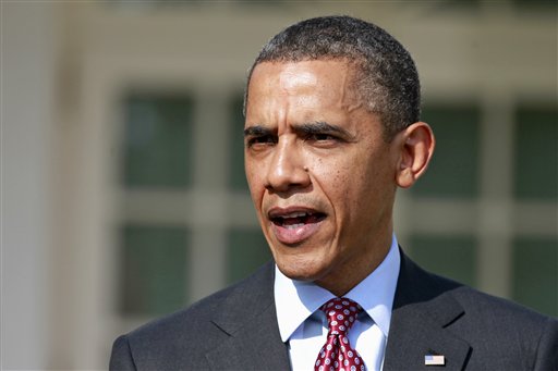 President Barack Obama answers a reporter's question about the death of Trayvon Martin today in the Rose Garden of the White House.