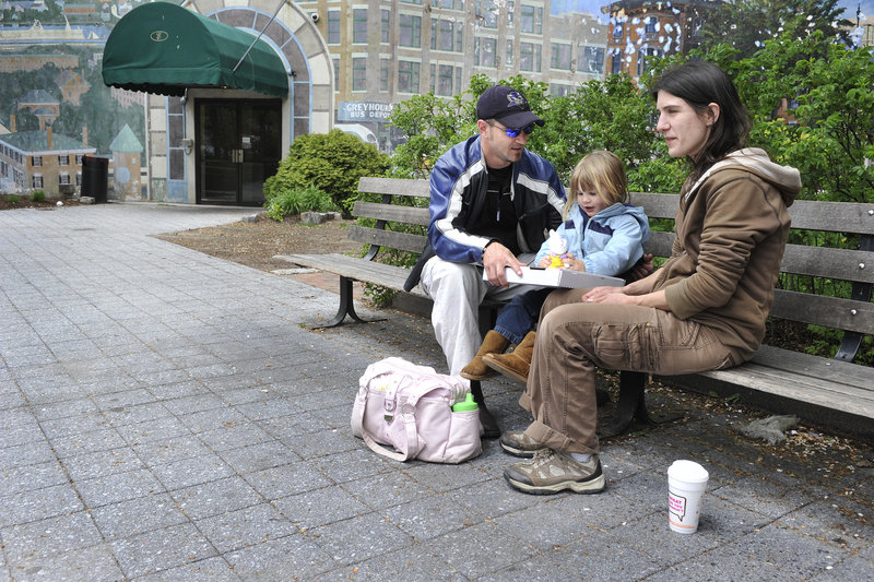 Visitors to Portland’s Congress Square Plaza share their thoughts on a proposal by the Eastland Park Hotel to expand and use the city park space for a ballroom. Lawrence Allen of Standish brought his wife, Cara Leavitt, and 3-year-old daughter, Alanah, to Portland, where they enjoyed pizza in Congress Square on Friday.