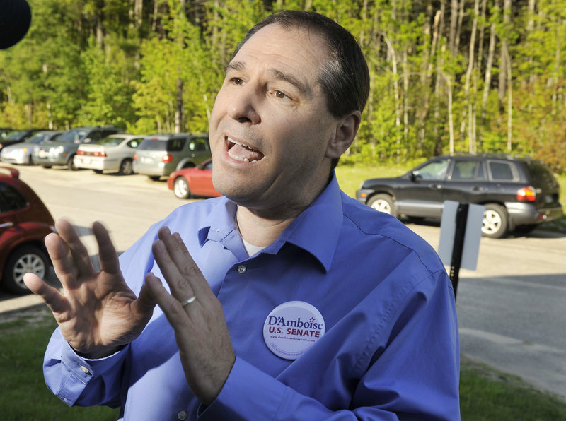 Scott D’Amboise, campaigning Saturday at a church supper in Lisbon, has embraced his outsider status.