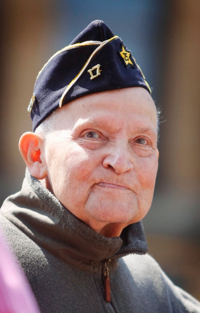 Joseph Bruni of Gorham, a retired member of the Army Air Corps, listens to speeches Monday while attending Memorial Day events in Portland.