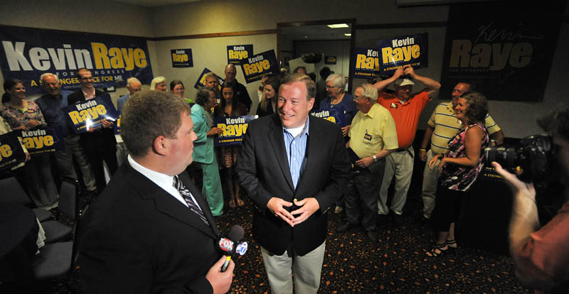 Staff photo by Michael G. Seamans Kevin Raye, candidate for US second congressional district, gives an interview in front of supporters at the Ramada Inn in Bangor Tuesday night.