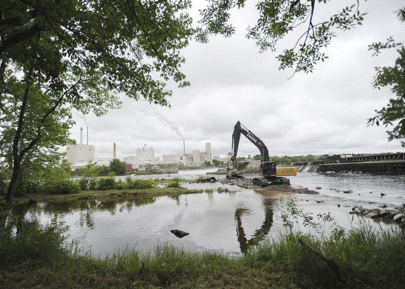 A crew from R.F. Jordan & Sons does advance work last week at the Great Works Dam on the Penobscot River in Old Town.