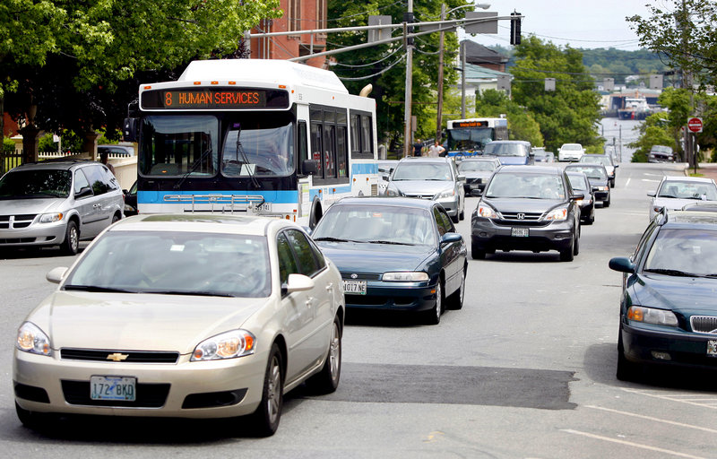 Traffic moves up High Street in Portland on Monday. A city proposal would make traffic on the street two-way once again.