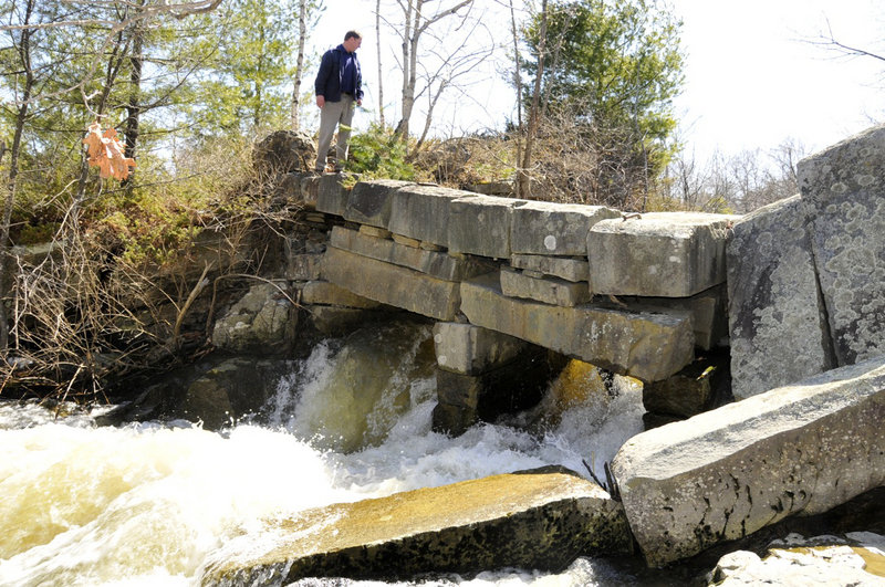 Courtesy TJD&A Taken in April 2008, this is one of the last known photos of the former granite bridge to Factory Island on the Royal River in Yarmouth. Tom Farmer, a landscape architect at Terrence J. DeWan & Associates in Yarmouth, was studying the area for a river corridor plan. The bridge, likely built decades ago as a dam with wooden spillways, collapsed into the river sometime after 2008.