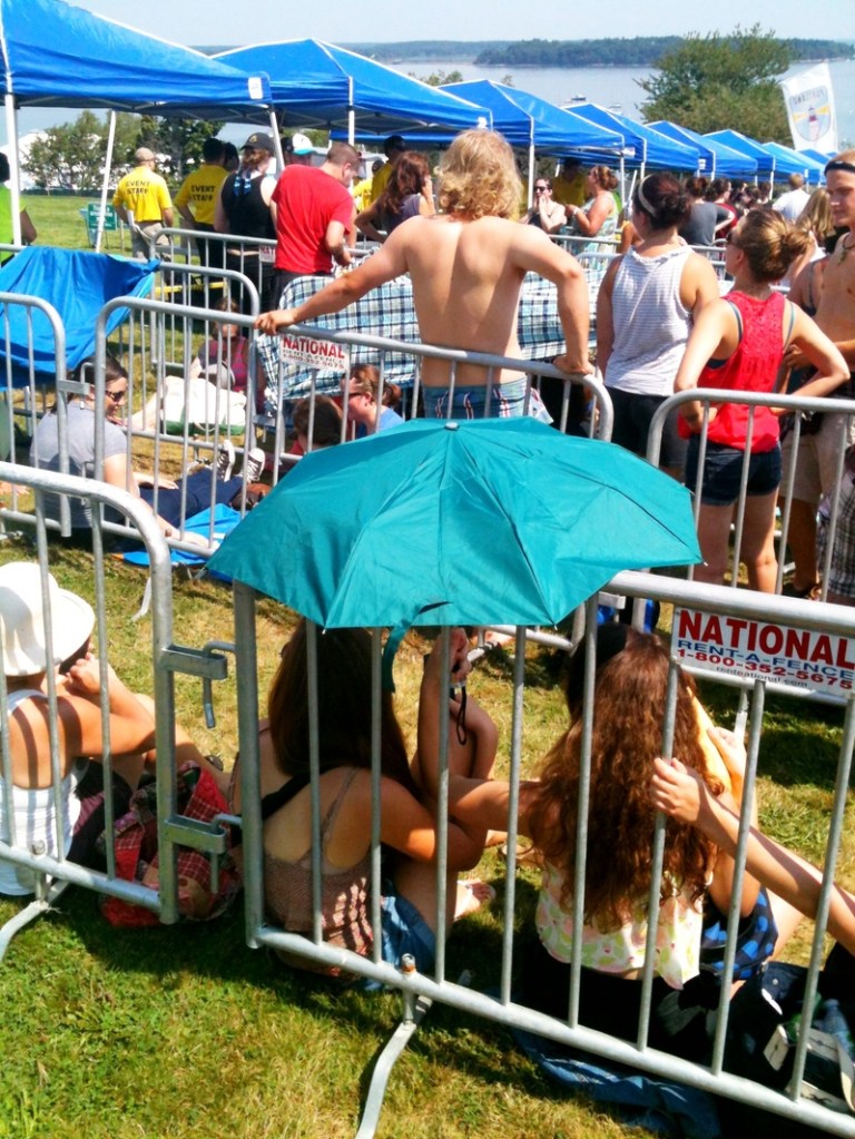 Festival-goers wait in line to get into the "Gentlemen of the Road Stopover" festival on Portland's Eastern Promenade on Saturday, August 4, 2012.