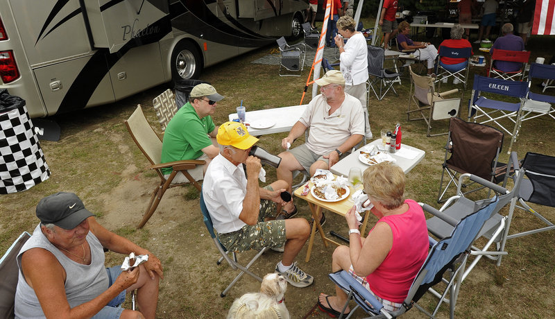 Members of the Yankee Travelers, a chapter of the Family Motor Coach Association, gather for dinner.