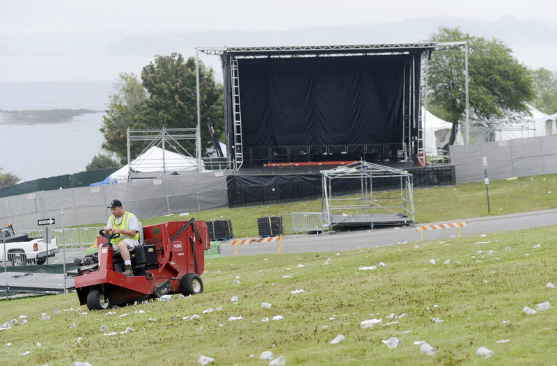 City worker Robert Fogg cleans up trash with a turf sweeper. Recycling efforts helped reduce the post-show litter, officials said.