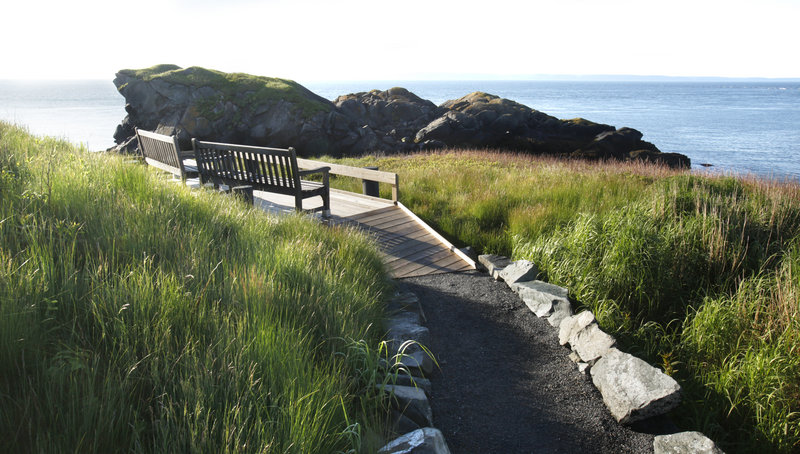 A path leads to benches overlooking Sugar Loaf Rock at Liberty Point in Roosevelt Campobello International Park. The number of visitors to the park has crept back up since 2009.